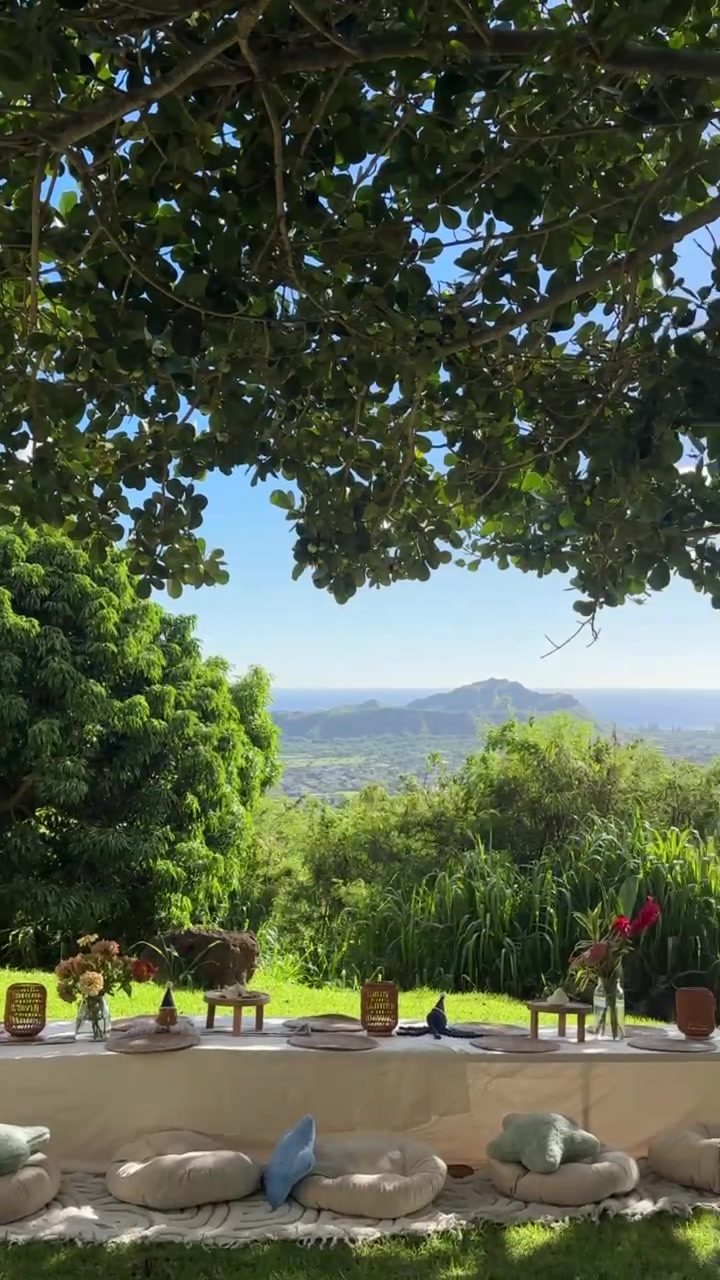Picnic table under a shade tree with mountain and ocean views