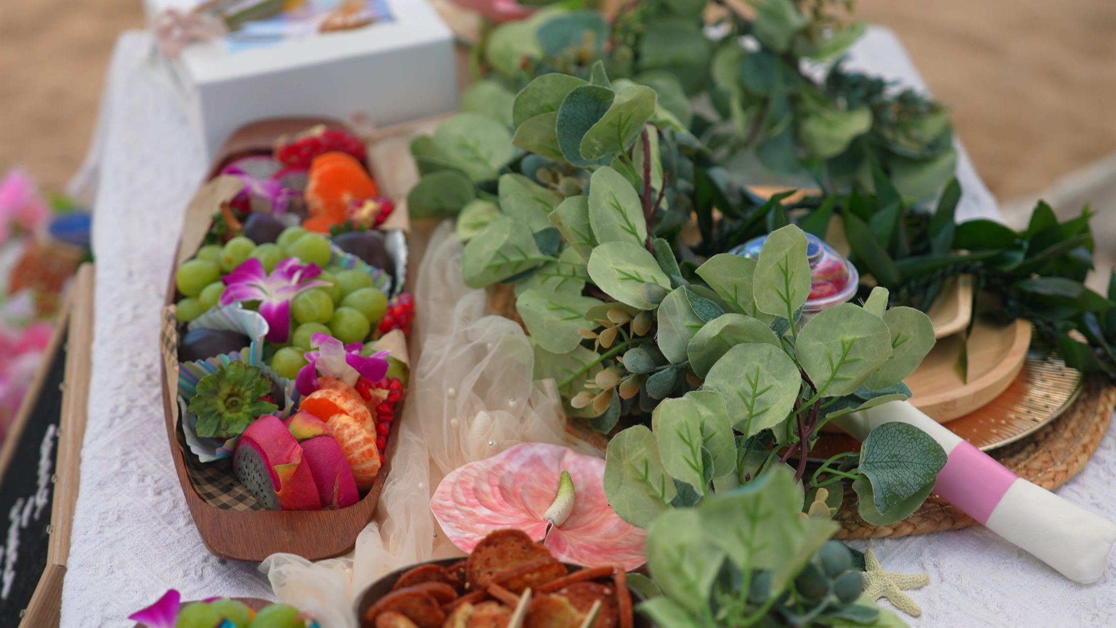 Signature tablescape with orchids and tropical grazing boards — Oahu Paradise Picnic