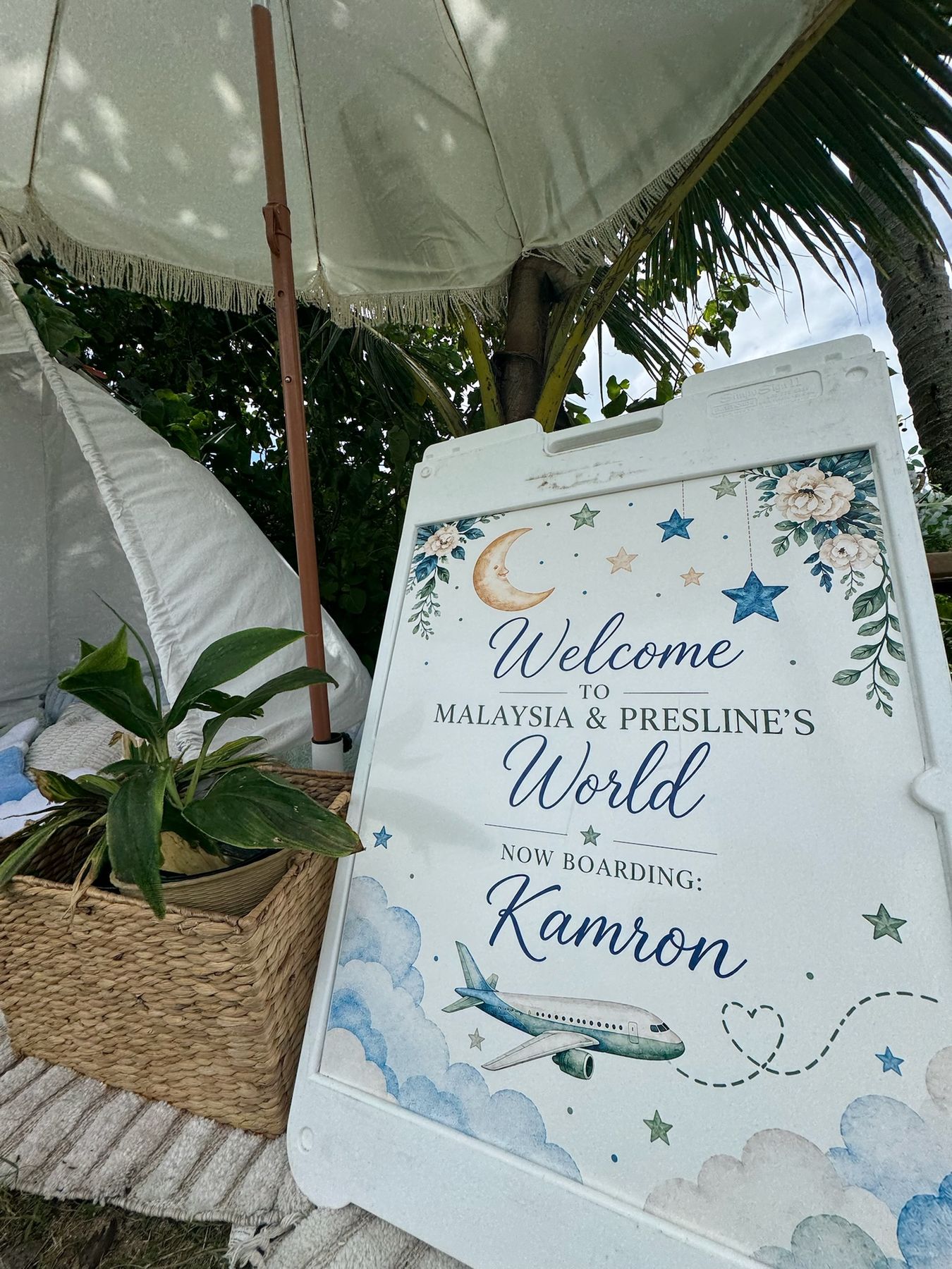 Custom baby shower welcome sign beside the teepee lounge